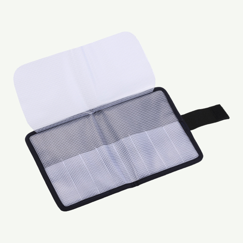 Screen cleaning kit with a white cloth and mesh pad on a white background