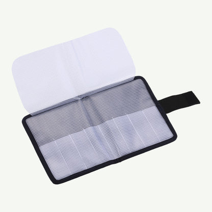 Screen cleaning kit with a white cloth and mesh pad on a white background