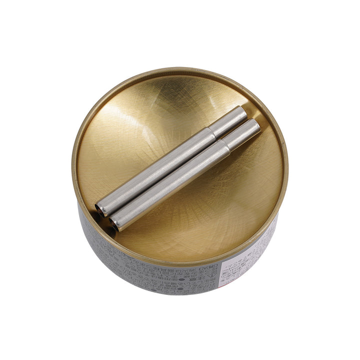 Gold lid with two silver cylindrical objects on a white background